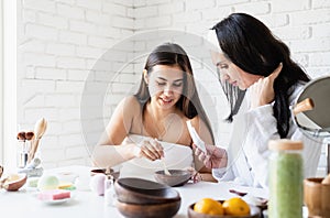 Women hands making facial mask doing spa procedures