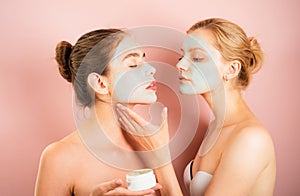 Spa and wellness. Girls friends sisters making clay facial mask. Anti age care. Stay beautiful. Skin care for all ages