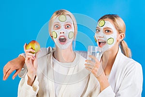 Spa and wellness. Girls friends sisters making clay facial mask. Anti age mask. Stay beautiful. Skin care for all ages