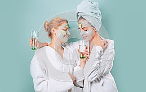 Spa and wellness. Girls friends sisters making clay facial mask. Anti age mask. Stay beautiful. Skin care for all ages