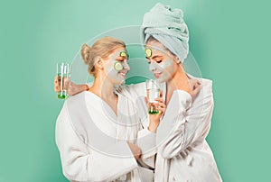 Spa and wellness. Girls friends sisters making clay facial mask. Anti age mask. Stay beautiful. Skin care for all ages