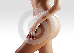 Spa, wellness. Healthy slim body. Beautiful hips. Fitness or plastic surgery. Perfect buttocks without cellulite