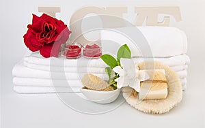 Spa wellness with red rose candles ,white towel ,milk soap and sea shell on white background