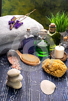 Spa and wellness setting with natural soap, candles, and towel