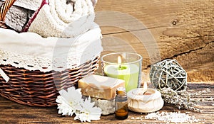 Spa and Wellness Setting with Towels,Candle, Natural Soap and Es