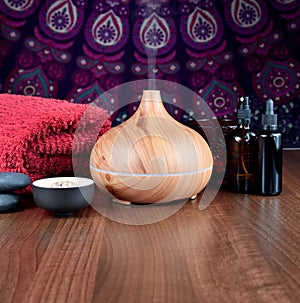 Spa and wellness setting with wooden humidifier stock images