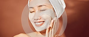 Spa Woman applying Facial clay Mask. Beauty Treatments