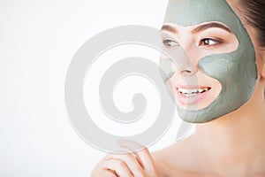 Spa Woman applying Facial cleansing Mask. Beauty Treatments