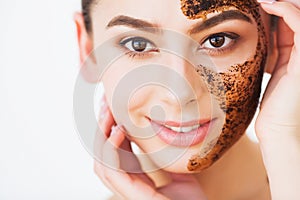 Spa Woman applying Facial cleansing Mask. Beauty Treatments