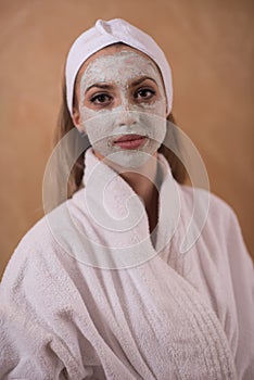Spa Woman applying Facial Mask