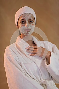 Spa Woman applying Facial Mask