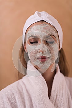 Spa Woman applying Facial Mask