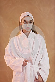 Spa Woman applying Facial Mask