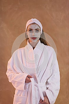 Spa Woman applying Facial Mask