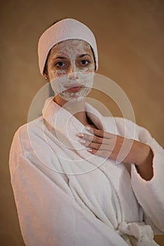 Spa Woman applying Facial Mask