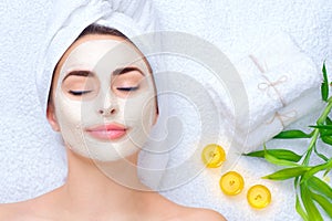 Spa woman applying facial mask photo