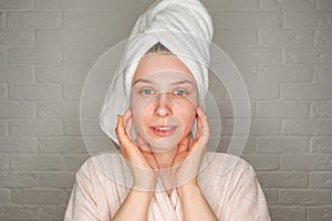 Spa woman applying facial mask. Daily female skincare routine concept.