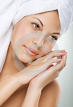 Spa Woman. Beautiful Girl After Bath Touching Her Face. Perfect Skin. Skincare. Young Skin