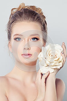 Spa Woman with Blonde Hair and White Rose Flowe