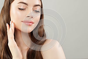 Spa woman with long healthy hair and clear skin close up portrait