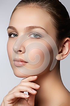 Spa woman. Natural beauty face. Beautiful girl touching her face. Perfect skin. Skincare. Young Skin. Manicured nails. Cosmetics &