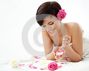 Spa Woman. Portrait of a Smiling Young Woman With Flower on a White Background.