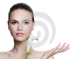 Spa woman showing empty copy space on the open hand isolated on white background. Skincare and wellness concept.