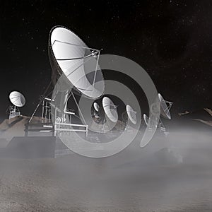 Space antenas on the desert in the foggy night photo