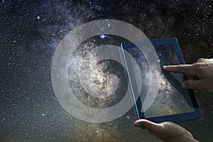 Space Astronomy Exploration Concept. Night Sky tablet Milky Way