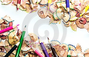 Space between colorful crayon pencil wood shavings