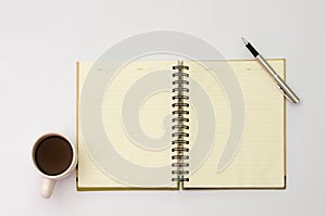 Space on the desk Area space enter text. mockup coffee cups snack candy, Pen note paper Placed on a White table top view desk ta