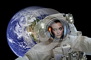 Space exploration. Astronaut in outer space. Planet earth from space on a dark background. Elements of this image were furnished