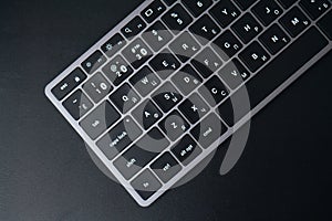 space gray keyboard on a black background.