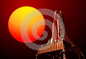 Space Launch System On Launchpad And Red Sun