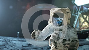 Space man in a spacesuit with a camera takes a soil sample and explores the moon, concept. Lunar expedition, creative idea. Man on