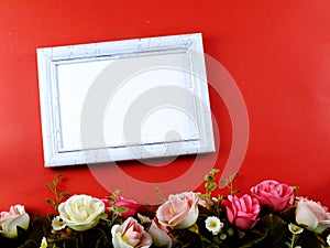 Space of photo frame with artificial rose flower