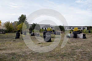 Space for playing paintball with the paint marks after fights. Abandoned paintball playground with barricades made of old tires