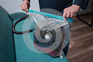 Space saver saving seal bag sucking air vacuum clothing storage compressed package.