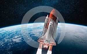 Space shuttle in the open space over the Earth. Elements of this image furnished by NASA