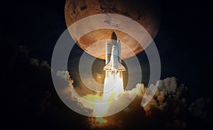 Space Shuttle takes off to mars. Elements of this image furnished by NASA