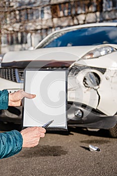 Space for text, blank document close up. An insurance agent will inspect and inspect vehicle damage after an accident