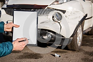 Space for text, blank document close up. An insurance agent will inspect and inspect vehicle damage after an accident