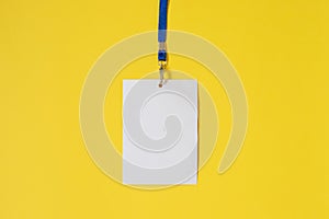 Empty ID card badge icon with blue belt, on yellow background.