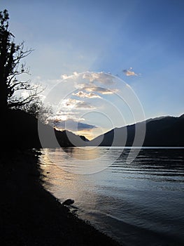 Space for text. Sunset in golden colors at Lake Walensee, Switzerland