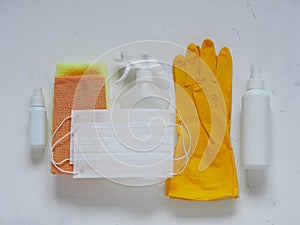 Space for text.Virus protection, medical gloves, medical protective mask and antiseptics are spread out on a white background.