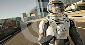 Space, travel and astronaut in city with discovery, future dystopia or planet for mission. Earth, aerospace suit and