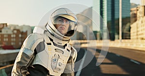 Space, travel and astronaut in city with helmet, future dystopia and hitchhiking on planet. Earth, aerospace mission and