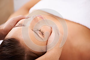 Space, woman and face massage for skincare, holistic therapy or healthy healing at cosmetics salon. Calm client relax at