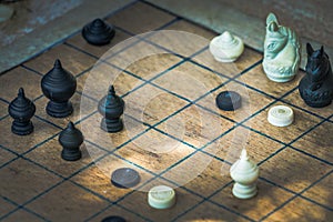 Thai Chess Figure on Wood Checkerboard, Tactics and Strategy Concept photo