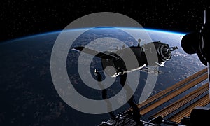 Spacecraft and spacestation at the Earth orbit photo